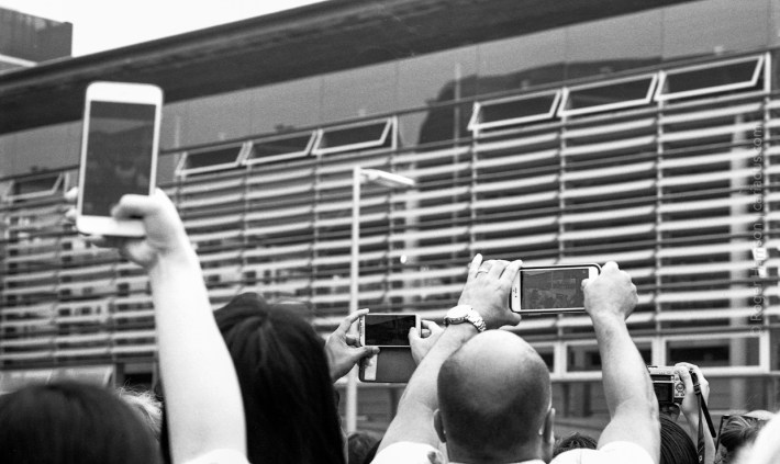 This was how many people viewed the events, with mobile phones held above heads