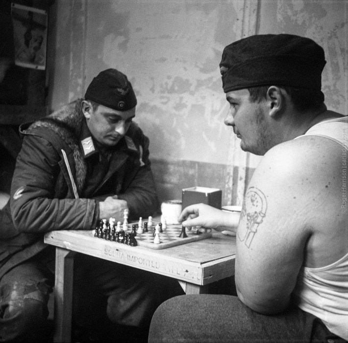 German POW re-enactors playing chess (Agfa Isolette, Tri-X)